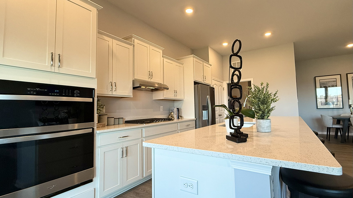The open floorplan features a well-designed kitchen complete with an oversized island.