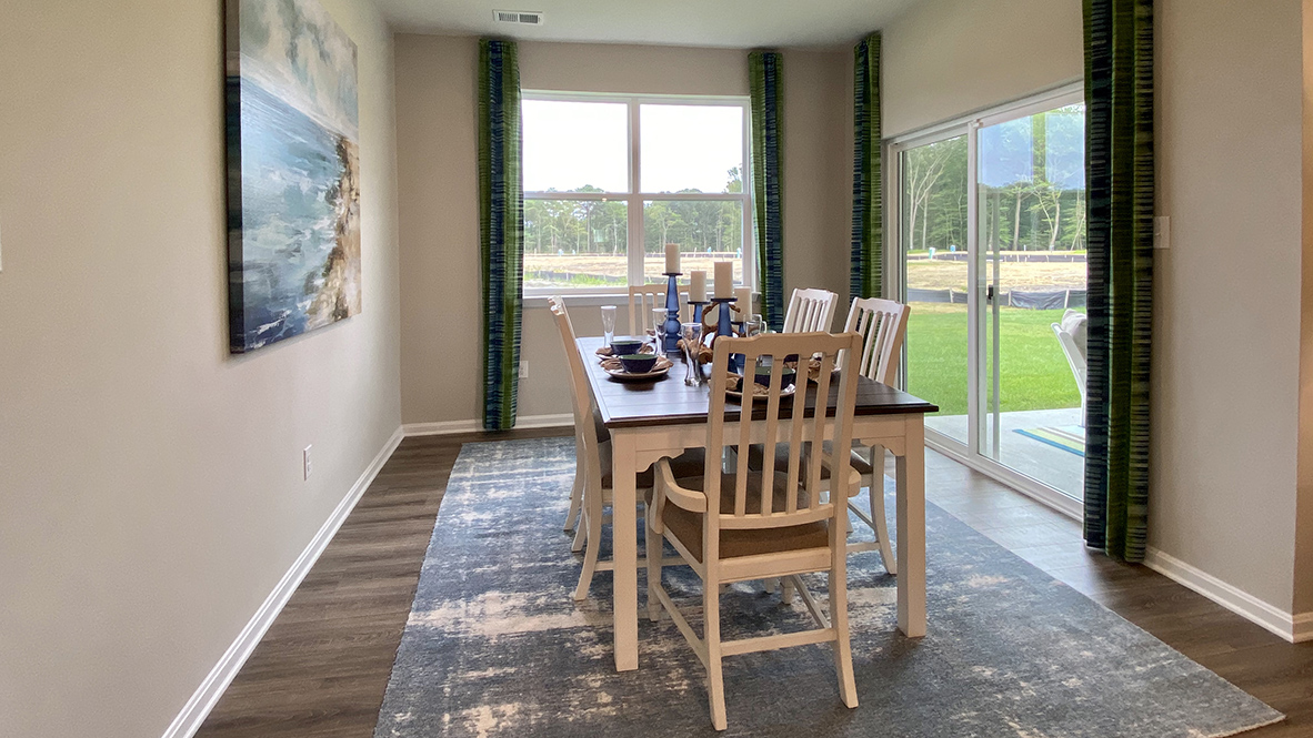 The dining area leads to the rear-covered patio.