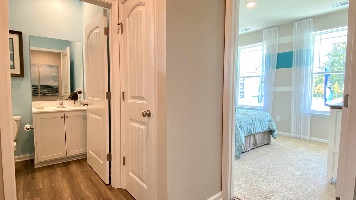 The guest bathroom is across the hall from guest bedroom.