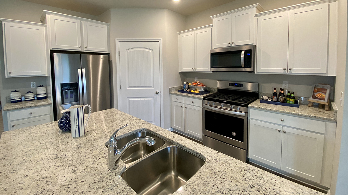 The kitchen offers upgraded countertops.