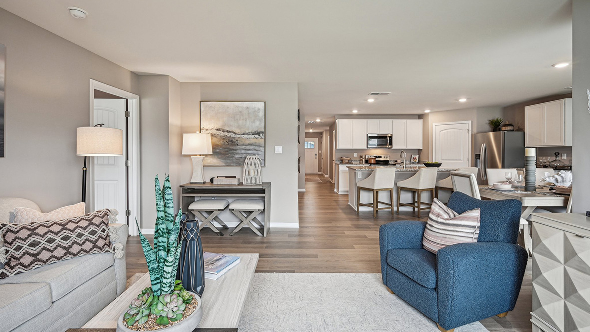 The open-concept floorplan connects the living, dining and kitchen.
