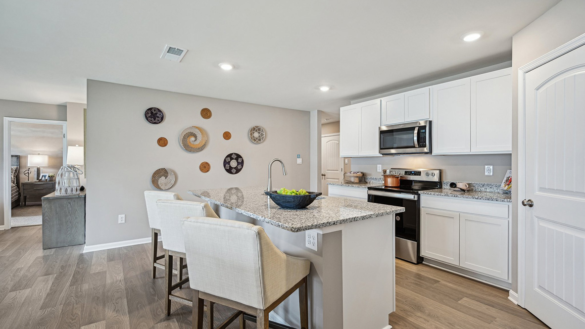 A sizable pantry closet is in the corner of the room.