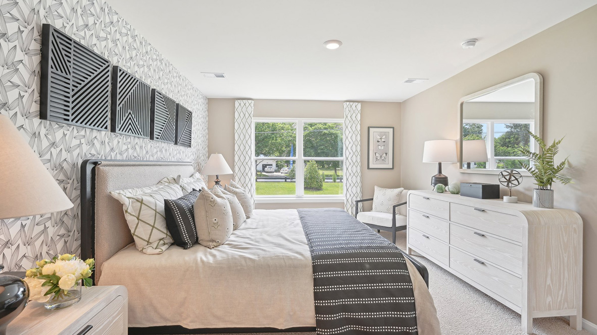 The primary bedroom has a large double window.