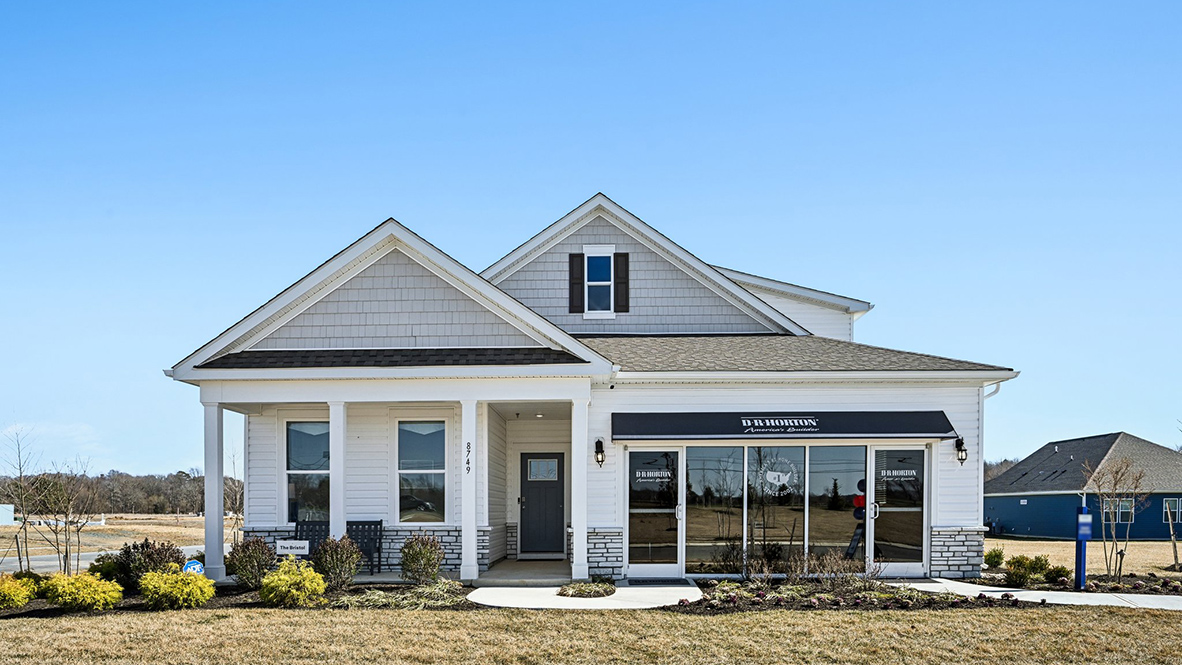 Gannon Range Bristol model home with white siding and white stone.