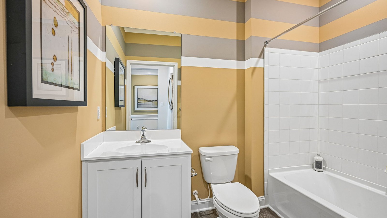 The guest bathroom is across the hall from guest bedroom.
