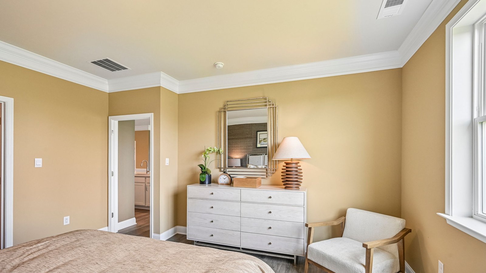 The large primary bedroom is a retreat in the back of the home.