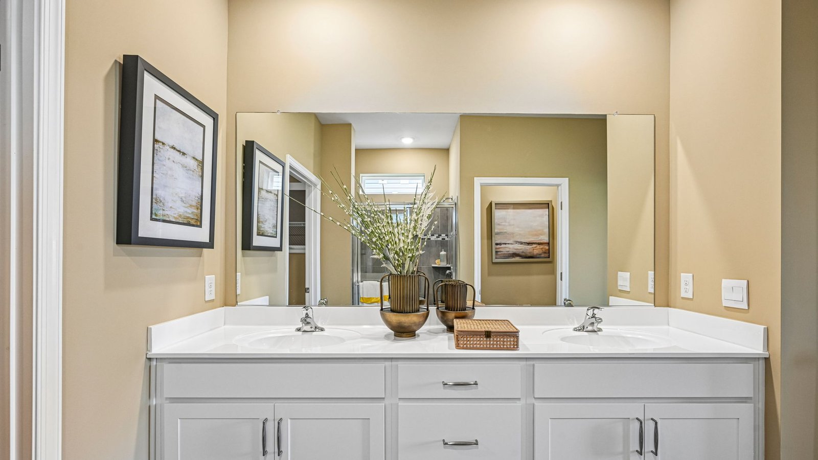 The primary bathroom has a substantial double bowl vanity.