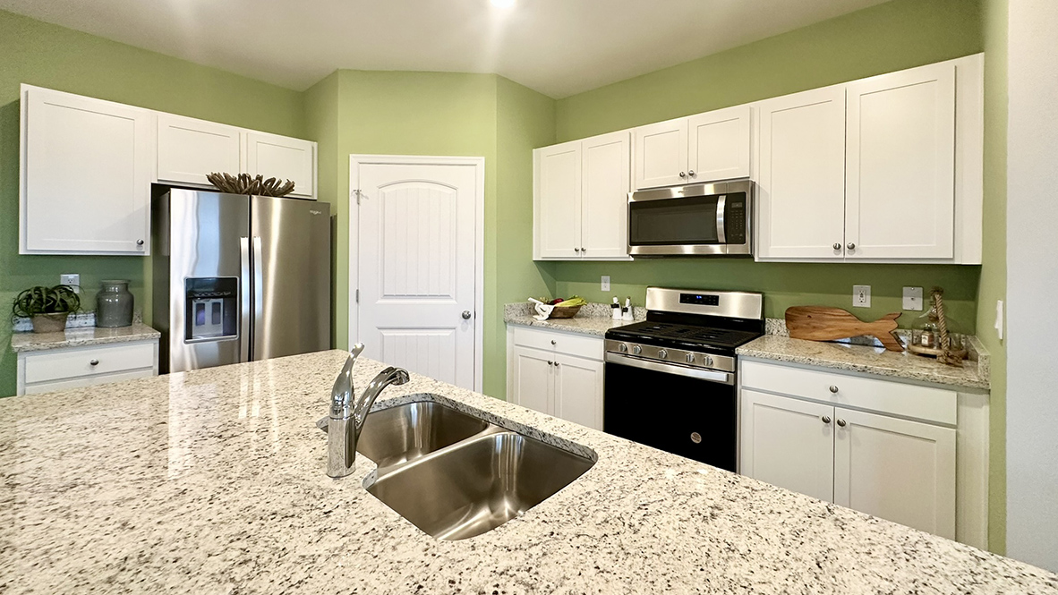 The kitchen offers upgraded countertops.
