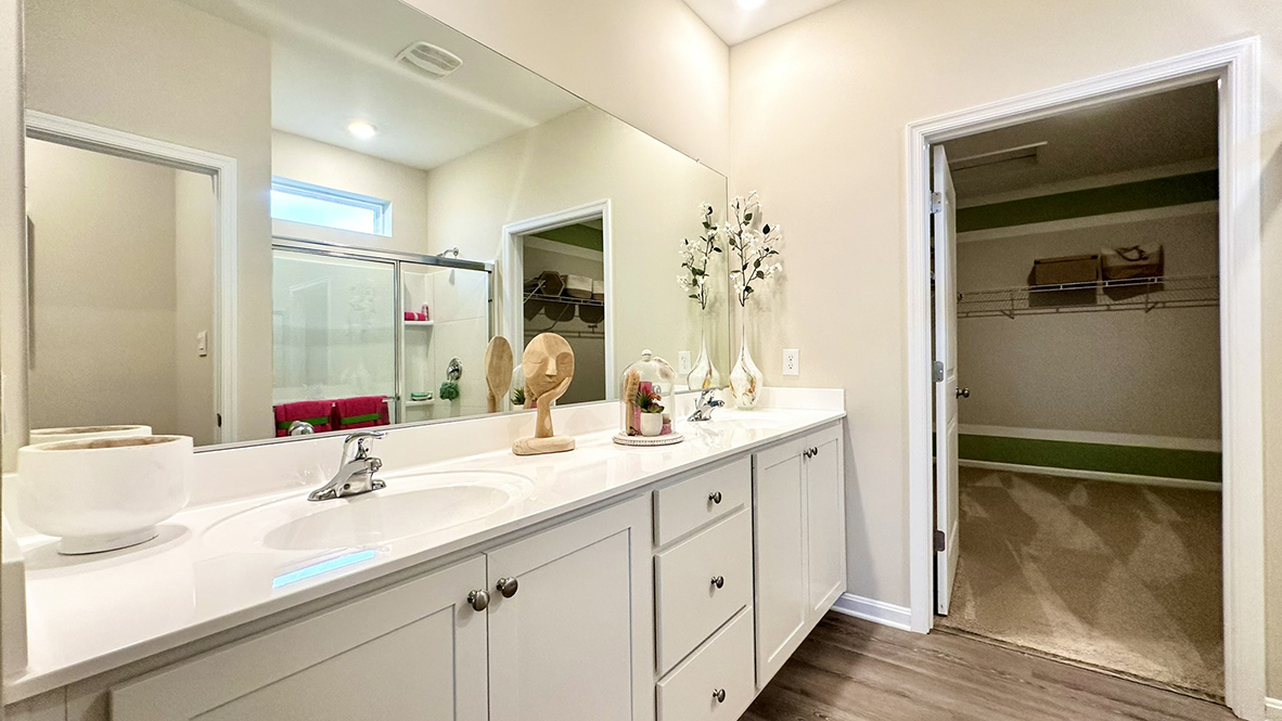 The primary bathroom has a substantial double bowl vanity.