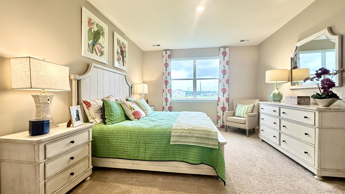 The large primary bedroom is a retreat in the back of the home.