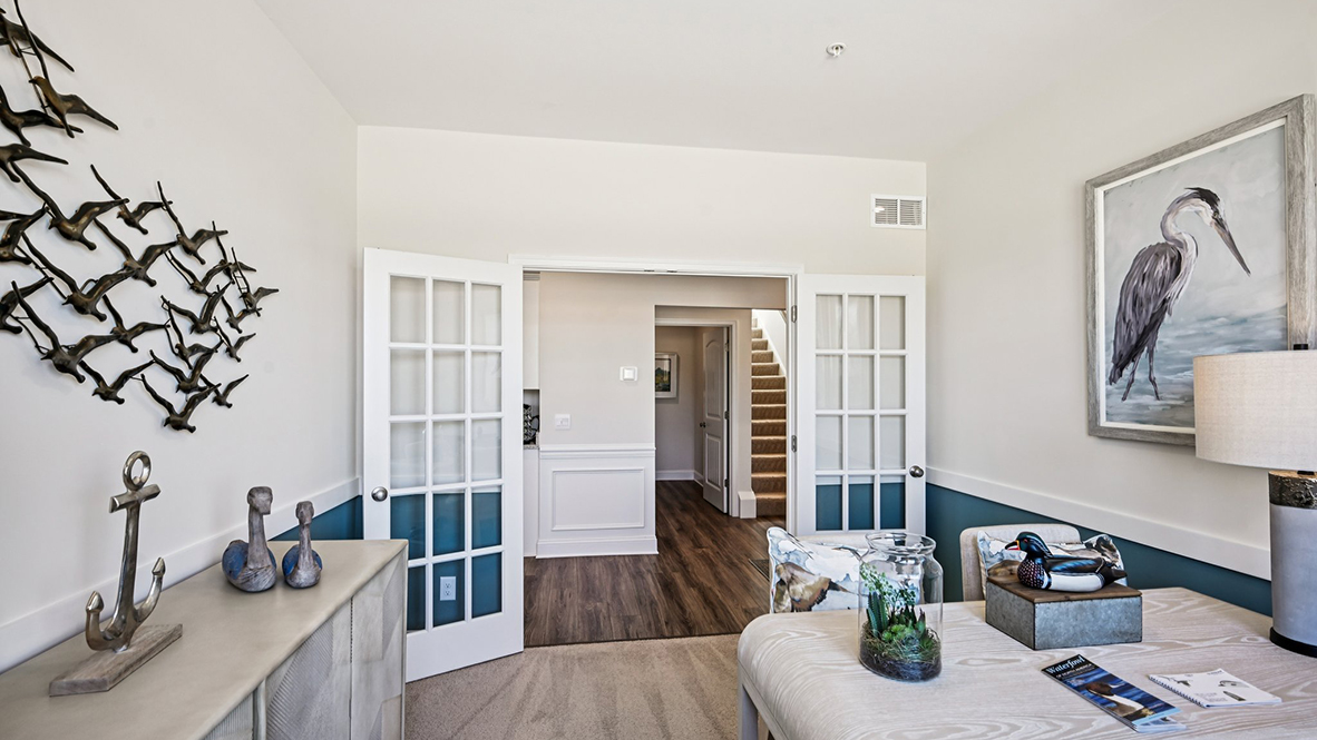 Stylish French doors open into the flex room.