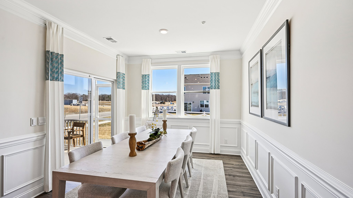 The dining area leads to the rear-covered patio.
