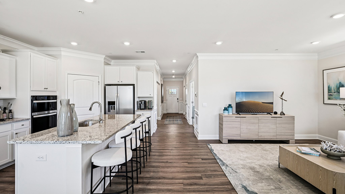 The kitchen is open to the ample living and dining rooms.