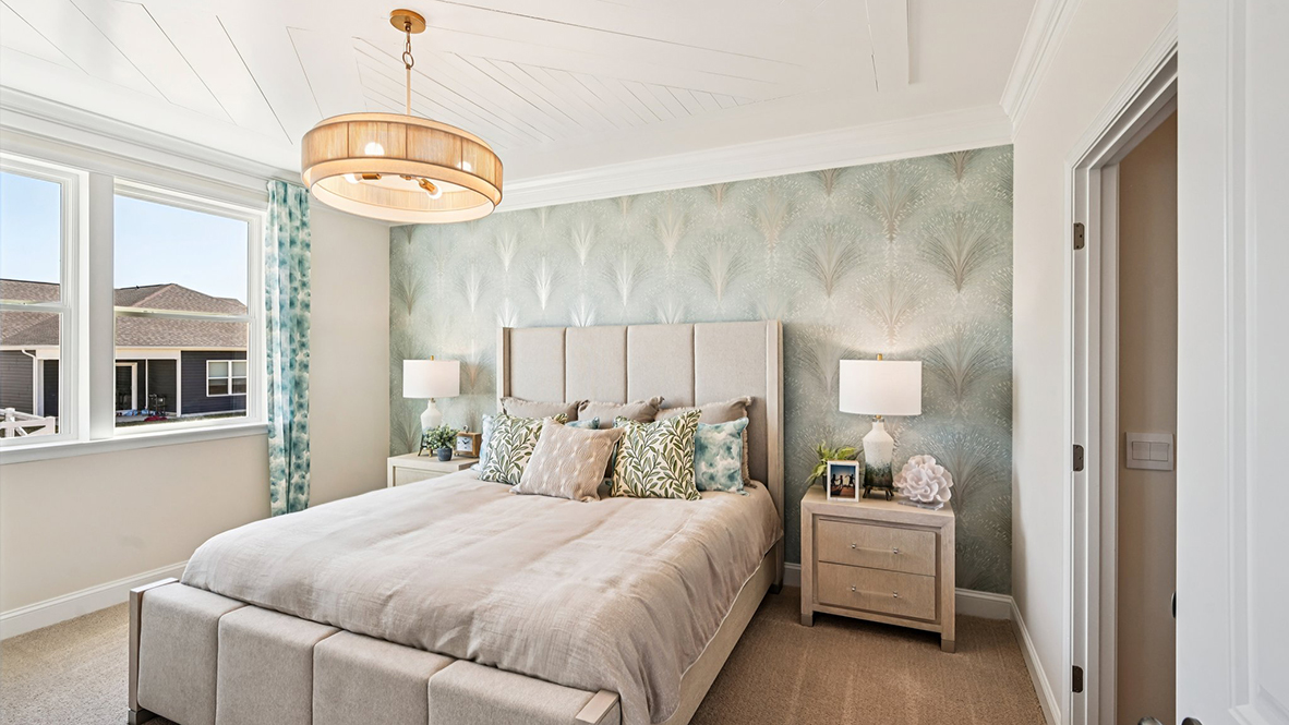 The large primary bedroom is a retreat in the back of the home.