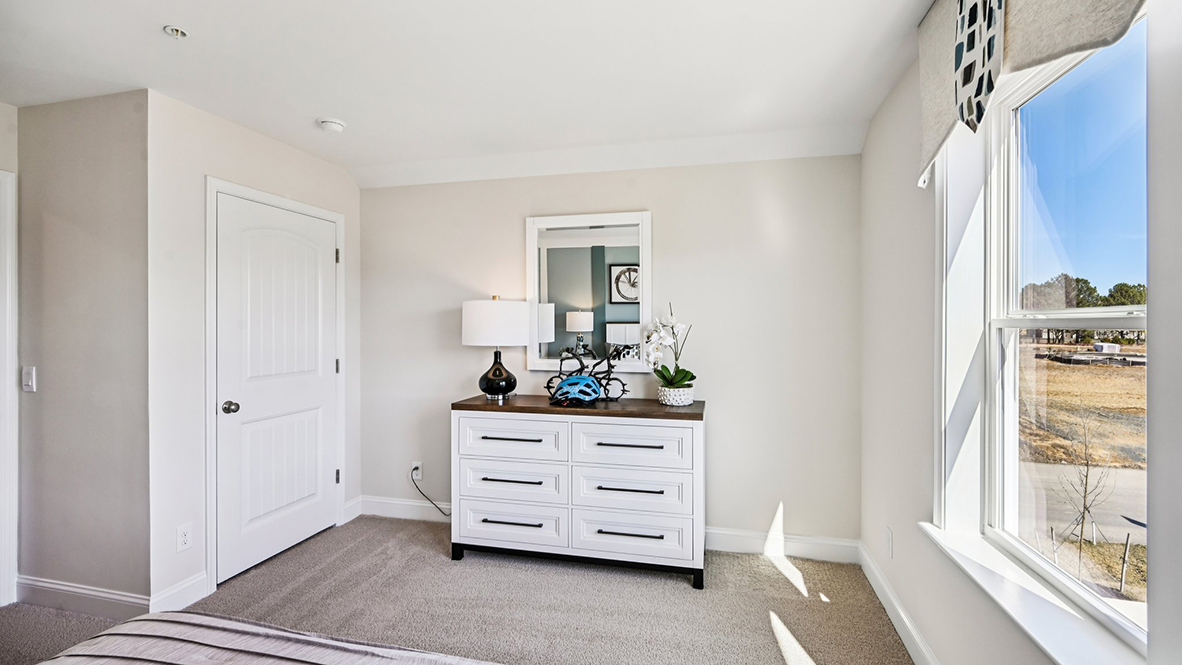 Upstairs, you will find a guest bedroom and bathroom.