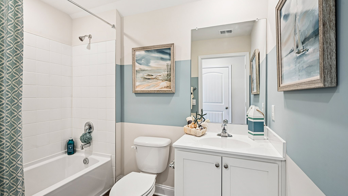 Upstairs, you will find a guest bedroom and bathroom.