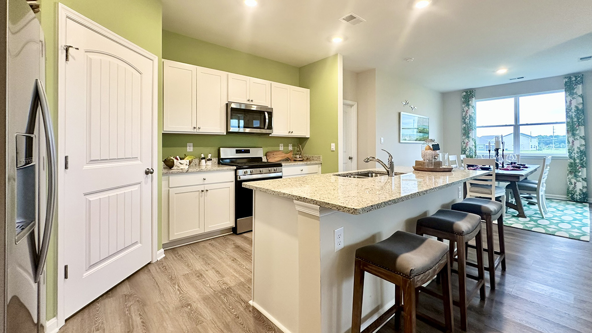 The kitchen is open to the ample living and dining rooms.
