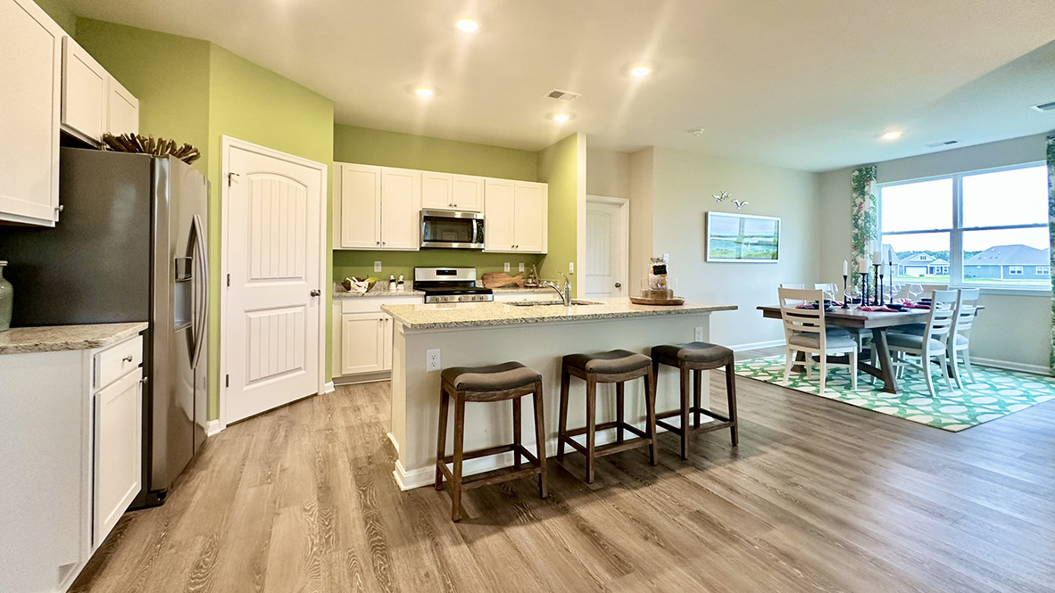 The kitchen is open to the ample living and dining rooms.