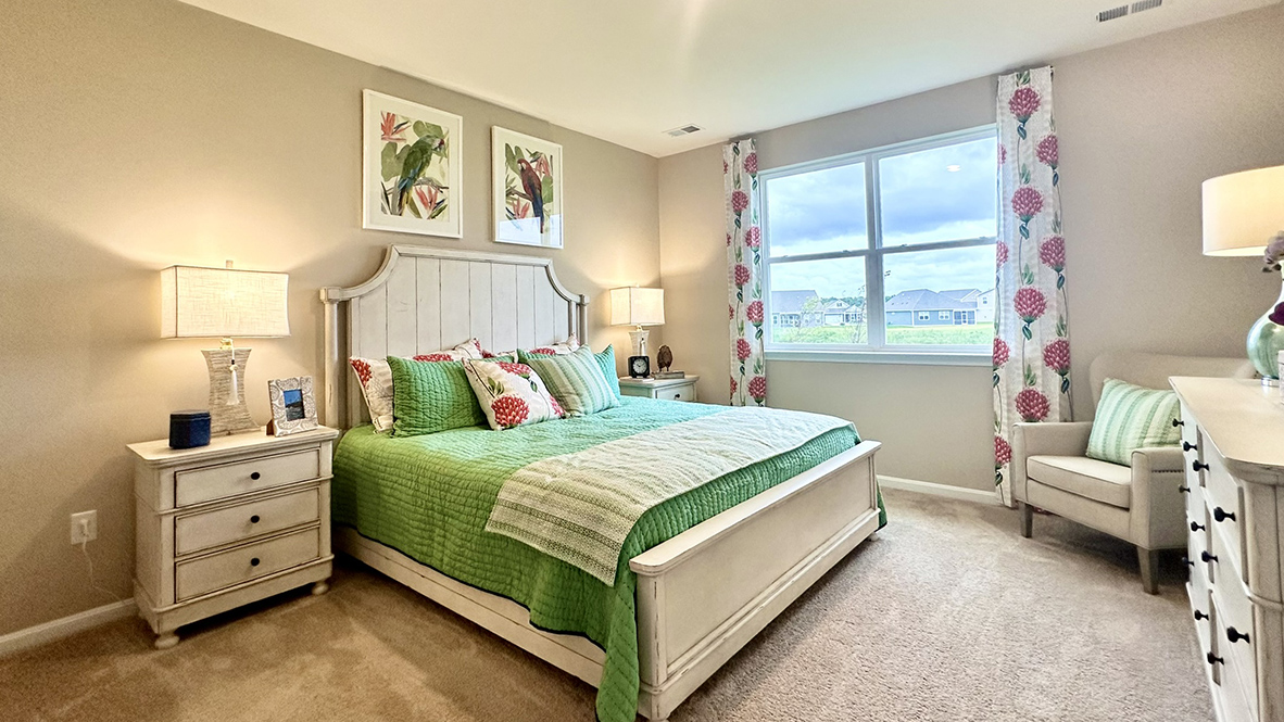 The large primary bedroom is a retreat in the back of the home.