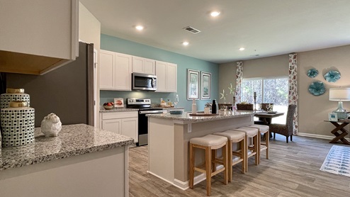 There are plenty of cabinets throughout the kitchen.