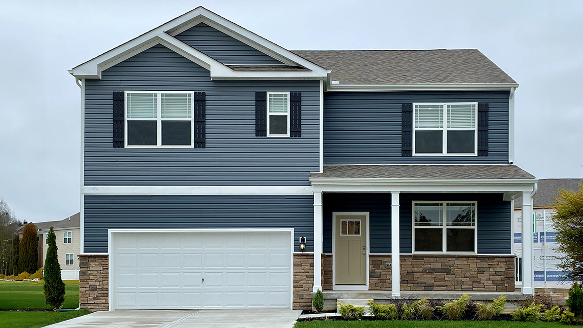 A two-story Hayden home with blue siding.