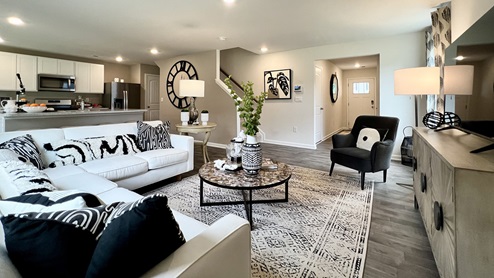 The open floorplan allows you and your loved ones to spend quality time together while in the living room, casual dining area and kitchen.