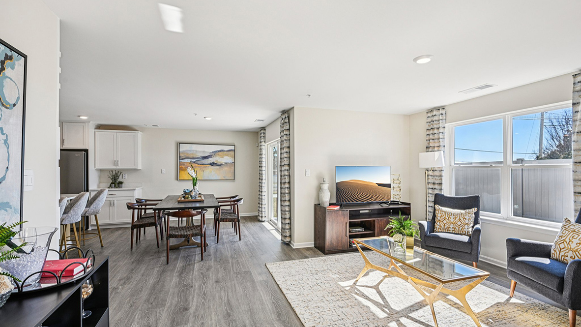 The open-concept floorplan connects the living, dining and kitchen.