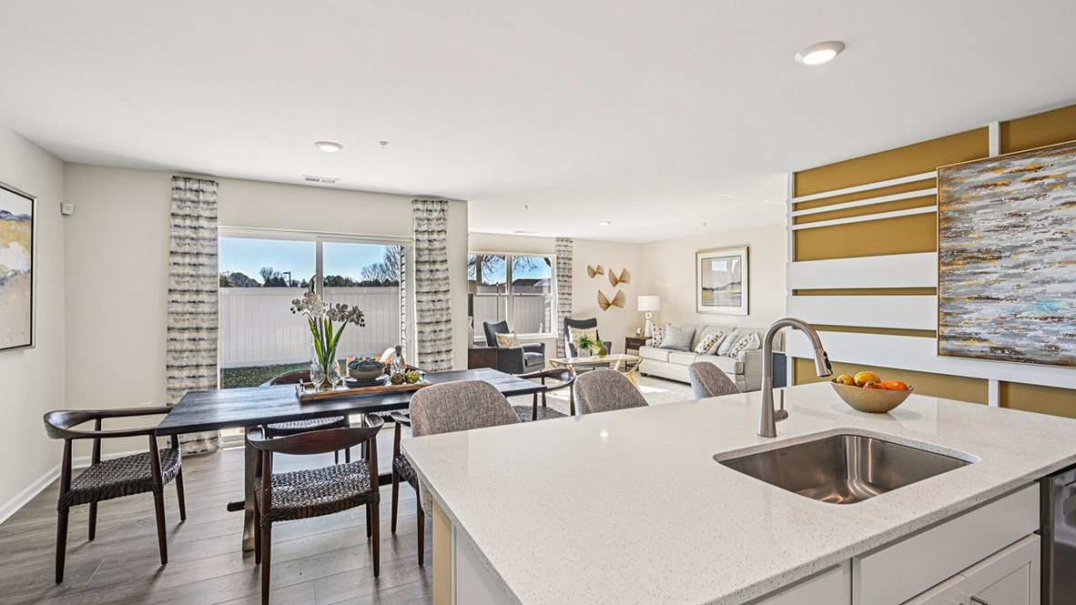 The kitchen includes a large center island with a sink.