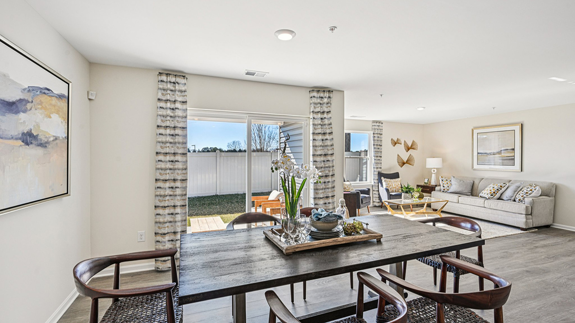 The open-concept floorplan connects the living, dining and kitchen.