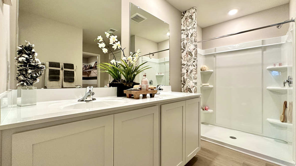 The primary bathroom has a double-bowl vanity.