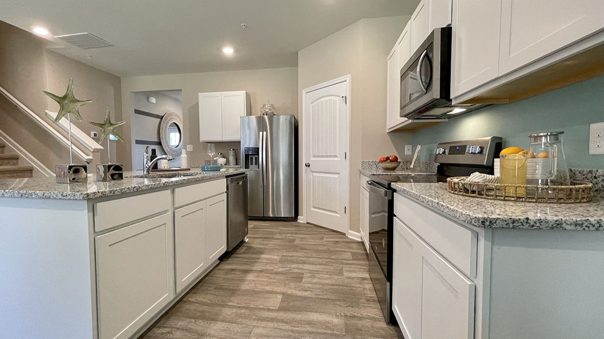There are plenty of cabinets throughout the kitchen.