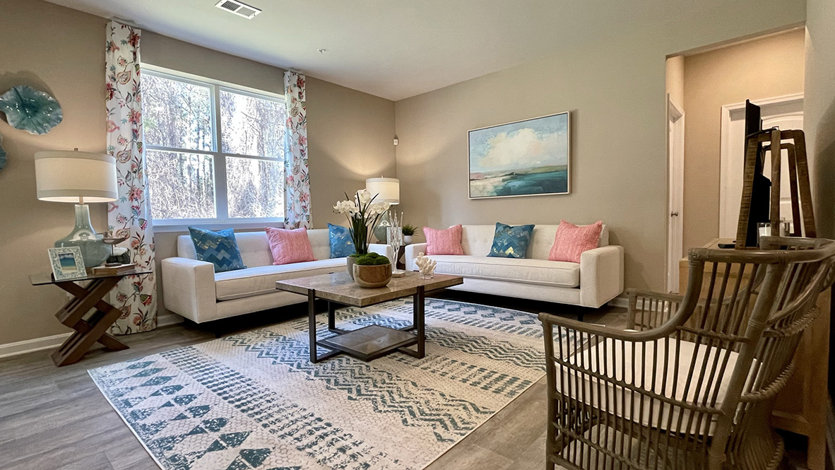 Large living room with large windows.
