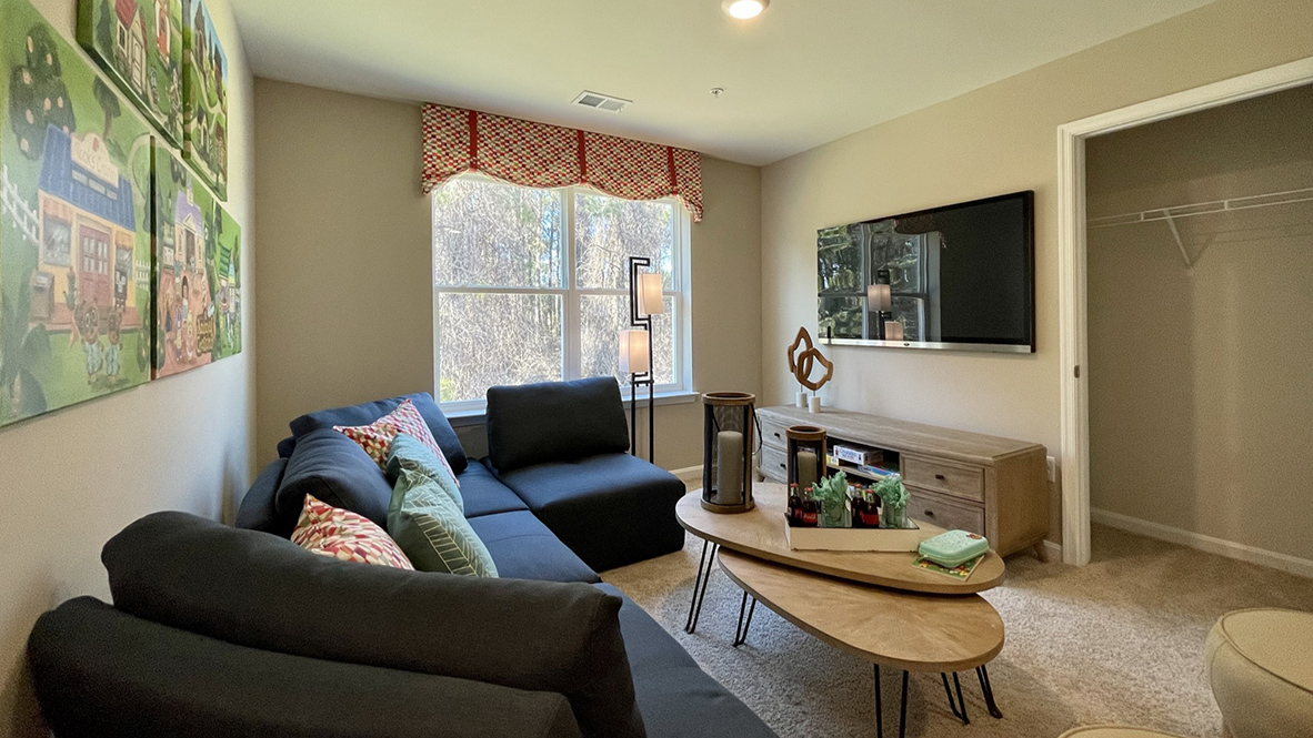 The inviting upstairs loft area at the top of the stairs.
