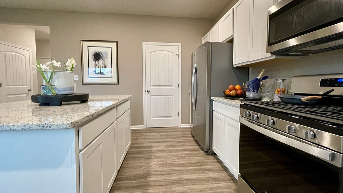 The spacious kitchen boasts stainless steel appliances.