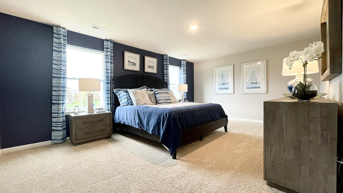 Upstairs, the owner’s suite boasts an ample bedroom.