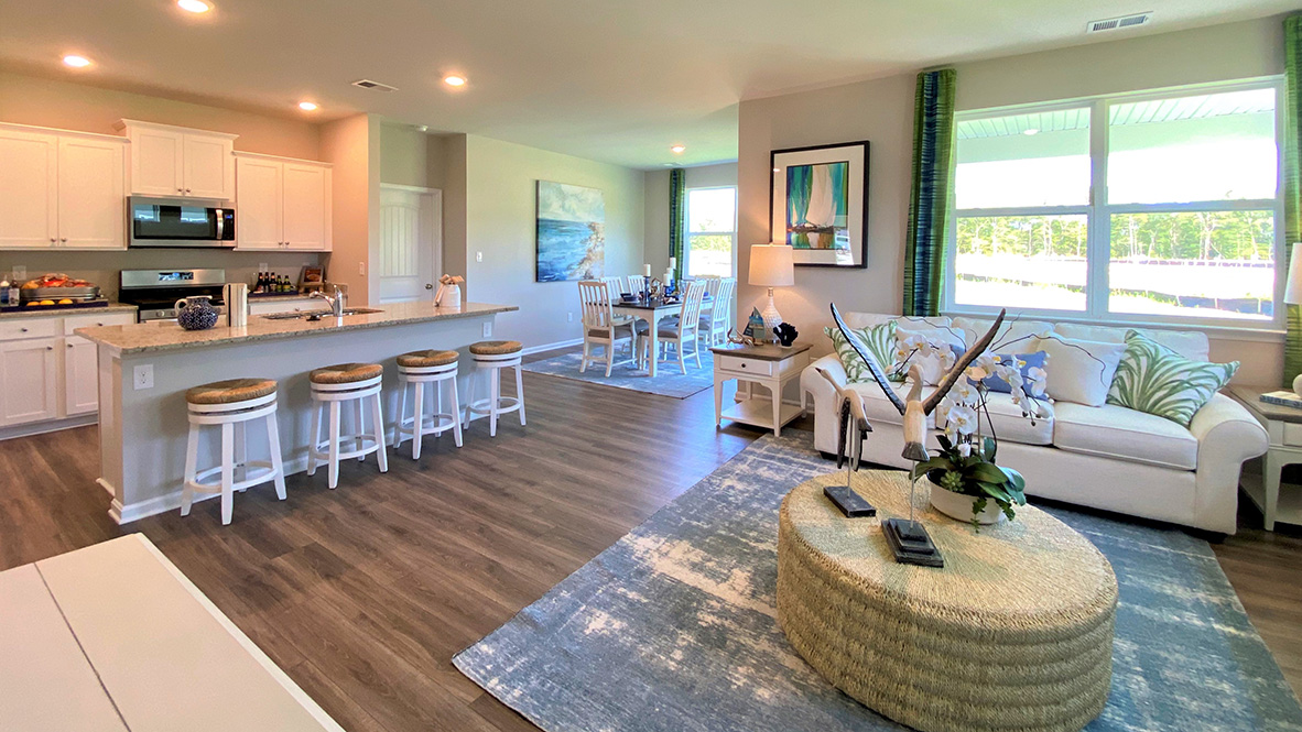 The kitchen is open to the ample living and dining rooms.