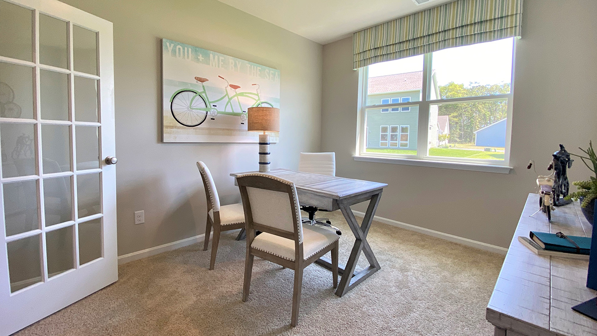 Stylish French doors give an abundance of natural light in the flex room.