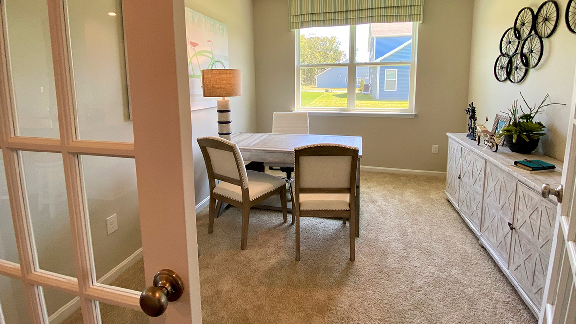 Stylish French doors give an abundance of natural light in the flex room.