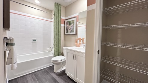 The upstairs bathroom includes a linen closet.