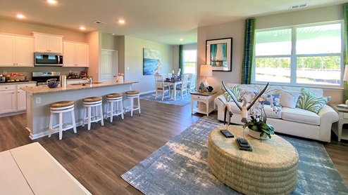 The kitchen is open to the ample living and dining rooms.