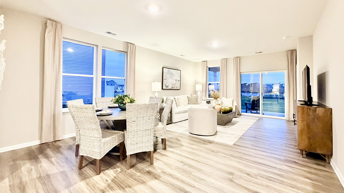 The great room provides access to the quiet covered porch at the rear of the home.
