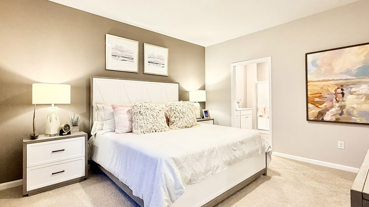 The private main suite is tucked in the back of the home and includes a large en suite bathroom.