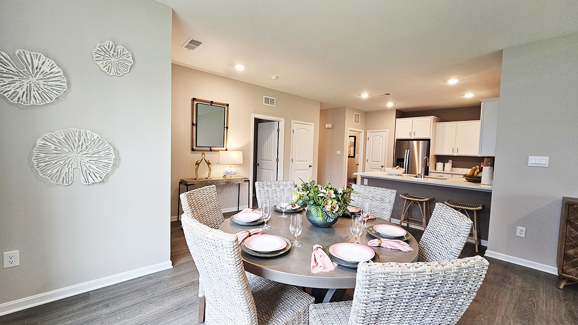 Upon entering the home, you step into the spacious living and dining area.