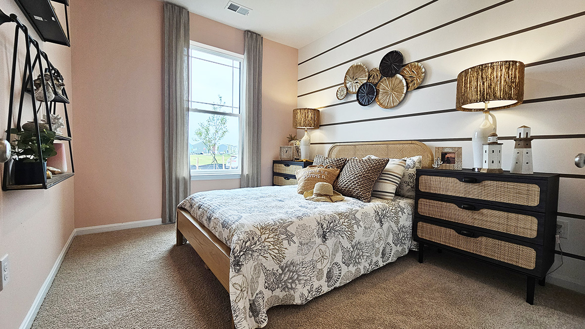 Continuing down the hall is another guest bedroom and a full bathroom.