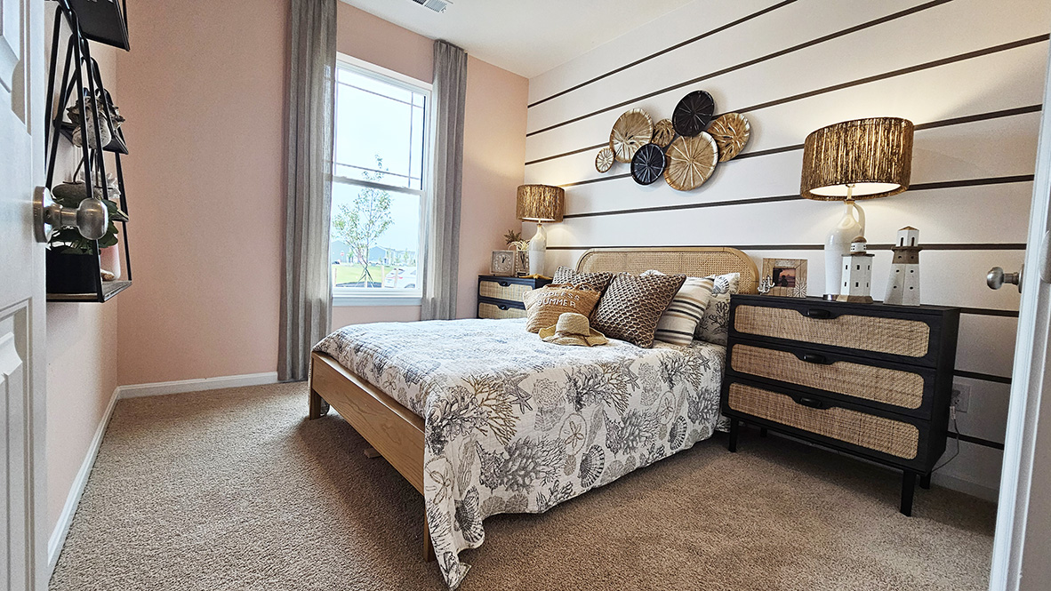 Continuing down the hall is another guest bedroom and a full bathroom.