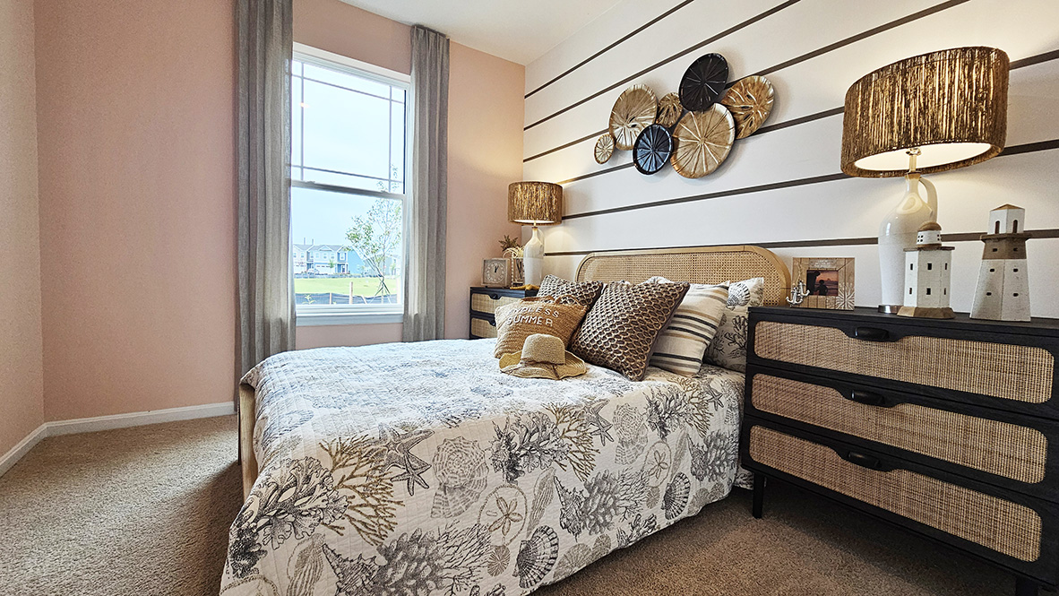 Continuing down the hall is another guest bedroom and a full bathroom.