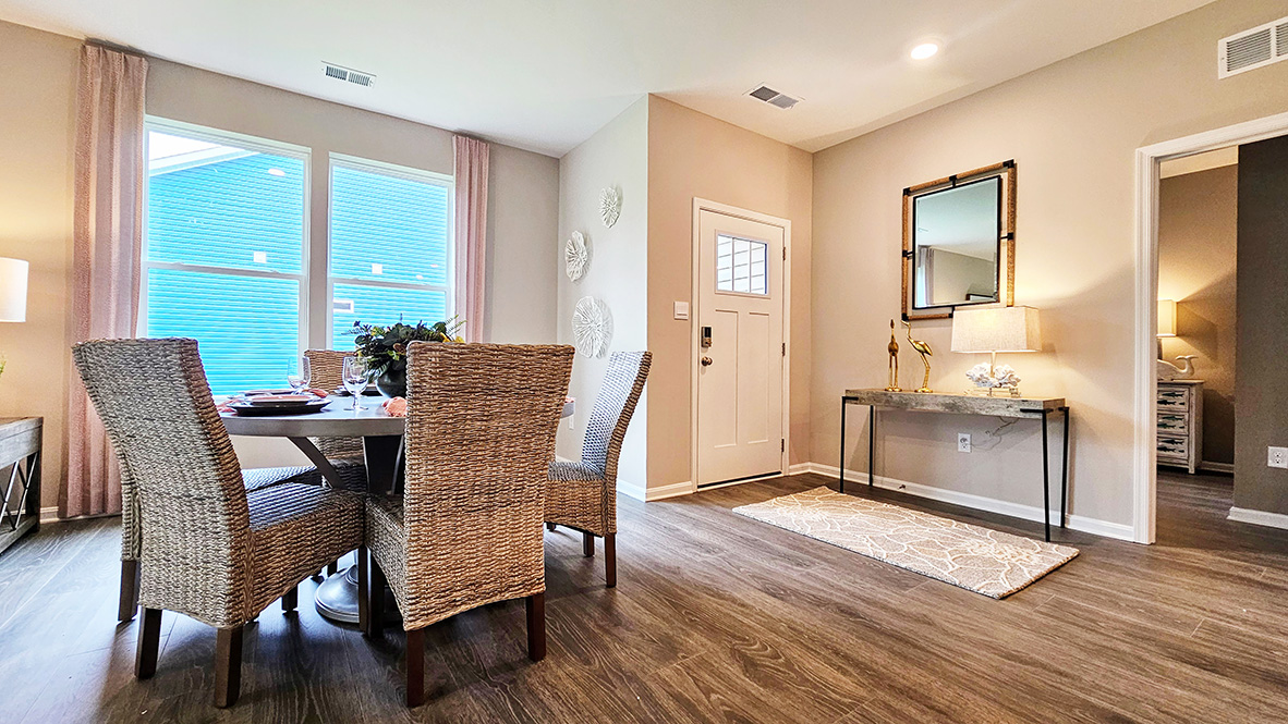 Upon entering the home, you step into the spacious living and dining area.