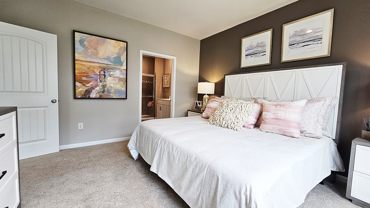 The private main suite is tucked in the back of the home and includes a large en suite bathroom.