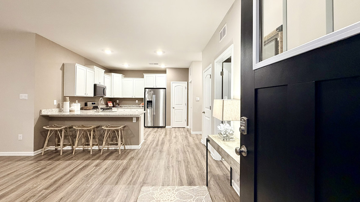 Upon entering the home, you step into the spacious living and dining area.