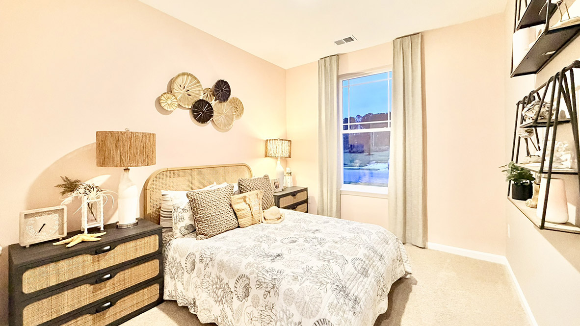 Continuing down the hall is another guest bedroom.